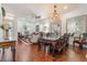 Elegant living room featuring hardwood floors, ornate furniture, and a decorative chandelier at 4450 Zev Ct, Las Vegas, NV 89121