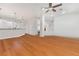 Bright, open-concept living room with hardwood floors and seamless transition into the modern kitchen at 4450 Zev Ct, Las Vegas, NV 89121