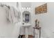 Elegant powder room with pedestal sink, ornate mirror, and stylish decor at 4450 Zev Ct, Las Vegas, NV 89121
