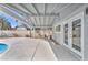 Inviting covered back patio with seating area and view of the backyard and pool at 4571 Mcmillan Rd, Las Vegas, NV 89121