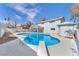 Large backyard featuring a sparkling blue pool, diving board, and shaded patio at 4571 Mcmillan Rd, Las Vegas, NV 89121