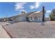 Well-maintained house featuring solar panels, desert landscaping, and a convenient two-car garage at 4571 Mcmillan Rd, Las Vegas, NV 89121