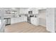 Modern white kitchen with stainless steel appliances, ample counter space, and bright, airy feel at 4571 Mcmillan Rd, Las Vegas, NV 89121
