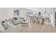 Spacious, open-concept living area with kitchen, dining, and access to outdoor patio and pool area at 4571 Mcmillan Rd, Las Vegas, NV 89121