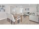 Bright living room with tile flooring, modern decor, a dining table, and comfortable seating areas at 4571 Mcmillan Rd, Las Vegas, NV 89121