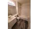 Bright bathroom featuring a tub, shower, modern vanity, and wood-look flooring at 5000 Red Rock St # 202, Las Vegas, NV 89118