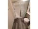 A clean bathroom featuring a glass shower, modern vanity, and wood-look flooring at 5000 Red Rock St # 202, Las Vegas, NV 89118