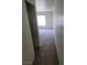 Carpeted bedroom with natural light from a large window, providing a cozy atmosphere at 5000 Red Rock St # 202, Las Vegas, NV 89118