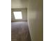 Bright bedroom with a large window, carpet flooring, and light neutral decor at 5000 Red Rock St # 202, Las Vegas, NV 89118
