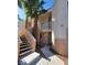 Inviting condo exterior with stairs leading to units, and palm trees at 5000 Red Rock St # 202, Las Vegas, NV 89118