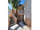 Inviting condo exterior with stairs leading to units, and palm trees at 5000 Red Rock St # 202, Las Vegas, NV 89118