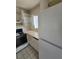 Kitchen featuring white cabinets, counter tops, and appliances at 5000 Red Rock St # 202, Las Vegas, NV 89118
