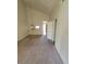 Bright, carpeted living room with vaulted ceiling, featuring bar seating and neutral decor at 5000 Red Rock St # 202, Las Vegas, NV 89118
