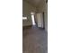 Bright, carpeted living room with vaulted ceiling, featuring bar seating and neutral decor at 5000 Red Rock St # 202, Las Vegas, NV 89118