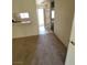 Living room featuring breakfast bar and tile flooring in hallway at 5000 Red Rock St # 202, Las Vegas, NV 89118