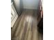 The image shows the flooring in the home. The floor is a wood-look tile or plank at 5080 Indian River Dr # 398, Las Vegas, NV 89103