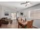 Inviting living space with wood floors, a comfortable couch, and an entertainment center at 5128 Canary Island Ct, North Las Vegas, NV 89031