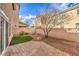 Private backyard showcasing a paver patio and small patch of grass; ideal for relaxing outdoors at 5486 Tartan Hill Ave, Las Vegas, NV 89141