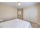 Bedroom featuring neutral carpet and a walk-in closet with sliding doors at 5486 Tartan Hill Ave, Las Vegas, NV 89141