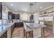 Bright kitchen with granite countertops, stainless steel appliances, and a central island at 5486 Tartan Hill Ave, Las Vegas, NV 89141