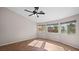 Spacious bedroom featuring multiple windows, a ceiling fan, and tile flooring at 5573 Wedge Ct, Las Vegas, NV 89122