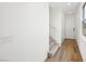 Inviting entryway featuring hardwood floors and a staircase leading to the upper level at 637 N Water St, Henderson, NV 89015