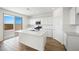 Modern kitchen featuring an island, stainless appliances, and ample counter space at 637 N Water St, Henderson, NV 89015