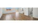 Bright and open living space featuring hardwood floors and access to the kitchen at 637 N Water St, Henderson, NV 89015