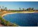Community pond with lush landscaping and walking paths, offering a tranquil outdoor space for residents at 637 N Water St, Henderson, NV 89015