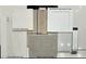 Selection board showing finishes: cabinets, flooring, quartz, shower tile, and backsplash samples with neutral tones at 637 N Water St, Henderson, NV 89015