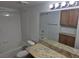 Bathroom featuring a shower and bathtub with white tile, granite countertops and mirrored vanity at 7255 W Sunset Rd # 1171, Las Vegas, NV 89113