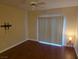 Spacious bedroom with hardwood floors, ceiling fan, and sliding glass doors for ample natural light at 7255 W Sunset Rd # 1171, Las Vegas, NV 89113