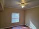 Cozy bedroom with ceiling fan, window, and hardwood floors, offering a comfortable living space at 7255 W Sunset Rd # 1171, Las Vegas, NV 89113