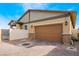 Attached two-car garage with a brick driveway and well-maintained landscaping at 794 Sunny Sagebrush St, Henderson, NV 89011