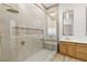 Modern bathroom featuring walk-in shower with glass door, and wood vanity with quartz countertop at 800 Jody Brook Ct, Las Vegas, NV 89145