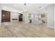 Spacious living room with hardwood floors, modern fireplace, and open-concept design into the kitchen at 800 Jody Brook Ct, Las Vegas, NV 89145