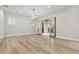 Bright living room features wood-look floors and glass doors leading to an outdoor space at 800 Jody Brook Ct, Las Vegas, NV 89145