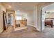 Hallway with staircase, carpet flooring, and open doorway to a bedroom at 865 Eureka Falls Ct, Henderson, NV 89052