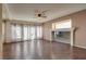 Bright living room with a ceiling fan and a decorative mantle, perfect for entertaining and relaxing at 865 Eureka Falls Ct, Henderson, NV 89052