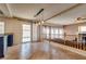 Open-concept living room with tile flooring, sliding glass doors, and a view of the backyard pool at 865 Eureka Falls Ct, Henderson, NV 89052