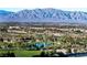 Scenic aerial view showcasing a golf course, lush greenery, and distant mountain range at 9101 Alta Dr # 1206, Las Vegas, NV 89145