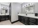 Elegant bathroom featuring dual vanities, sleek black cabinets, and modern lighting at 9101 Alta Dr # 1206, Las Vegas, NV 89145