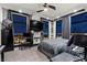 Bedroom with hardwood floors, city views, and a workspace at night at 9101 Alta Dr # 1206, Las Vegas, NV 89145