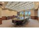 Spacious conference room features coffered ceilings, wood trim, and large windows with views at 9101 Alta Dr # 1206, Las Vegas, NV 89145