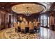 Grand dining room with an ornate chandelier, elegant decor, and a circular table for formal gatherings at 9101 Alta Dr # 1206, Las Vegas, NV 89145