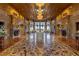 Grand foyer featuring marble flooring, an elegant chandelier, and decorative wall niches at 9101 Alta Dr # 1206, Las Vegas, NV 89145