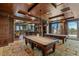Elegant game room with two pool tables, a bar, and access to an outdoor terrace with stunning views at 9101 Alta Dr # 1206, Las Vegas, NV 89145