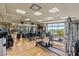 Well-equipped gym with modern exercise machines, mirrored walls, and natural light for a healthy lifestyle at 9101 Alta Dr # 1206, Las Vegas, NV 89145