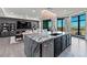 Open-concept living area with a modern island kitchen and views of the city at 9101 Alta Dr # 1206, Las Vegas, NV 89145