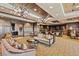 Spacious living room with elegant seating, hardwood floors, and access to a library and study area at 9101 Alta Dr # 1206, Las Vegas, NV 89145